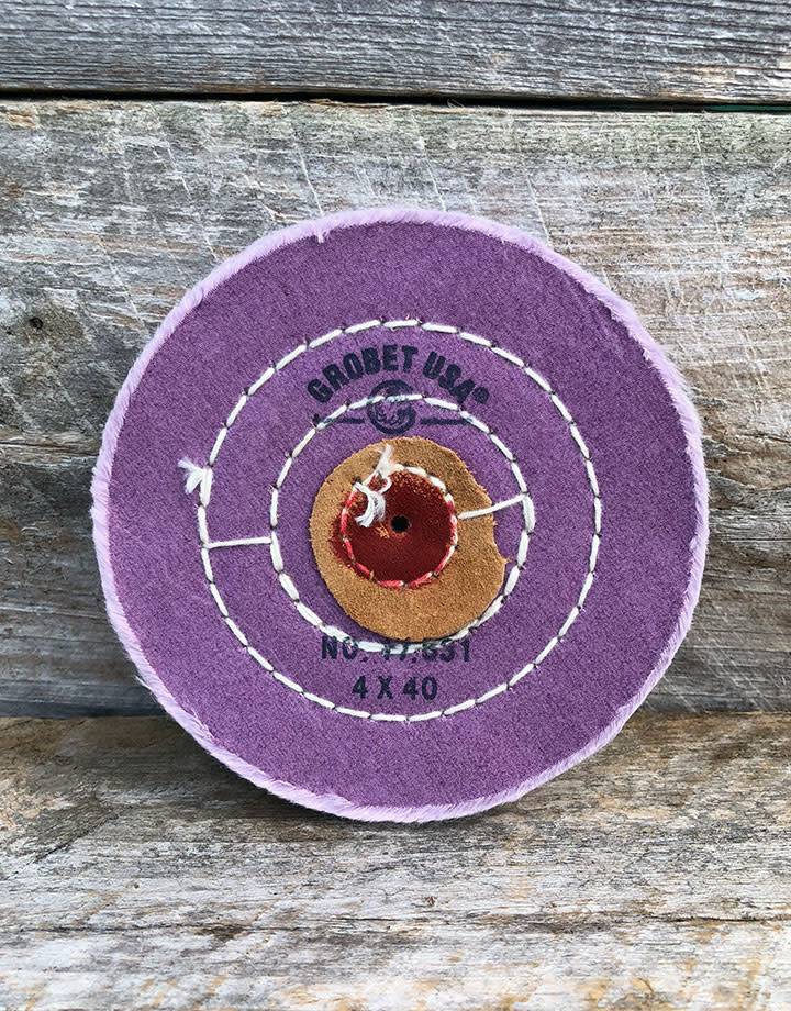 17-53X = Berry Treated Muslin Buff with Leather Center 4'' x 40 ply