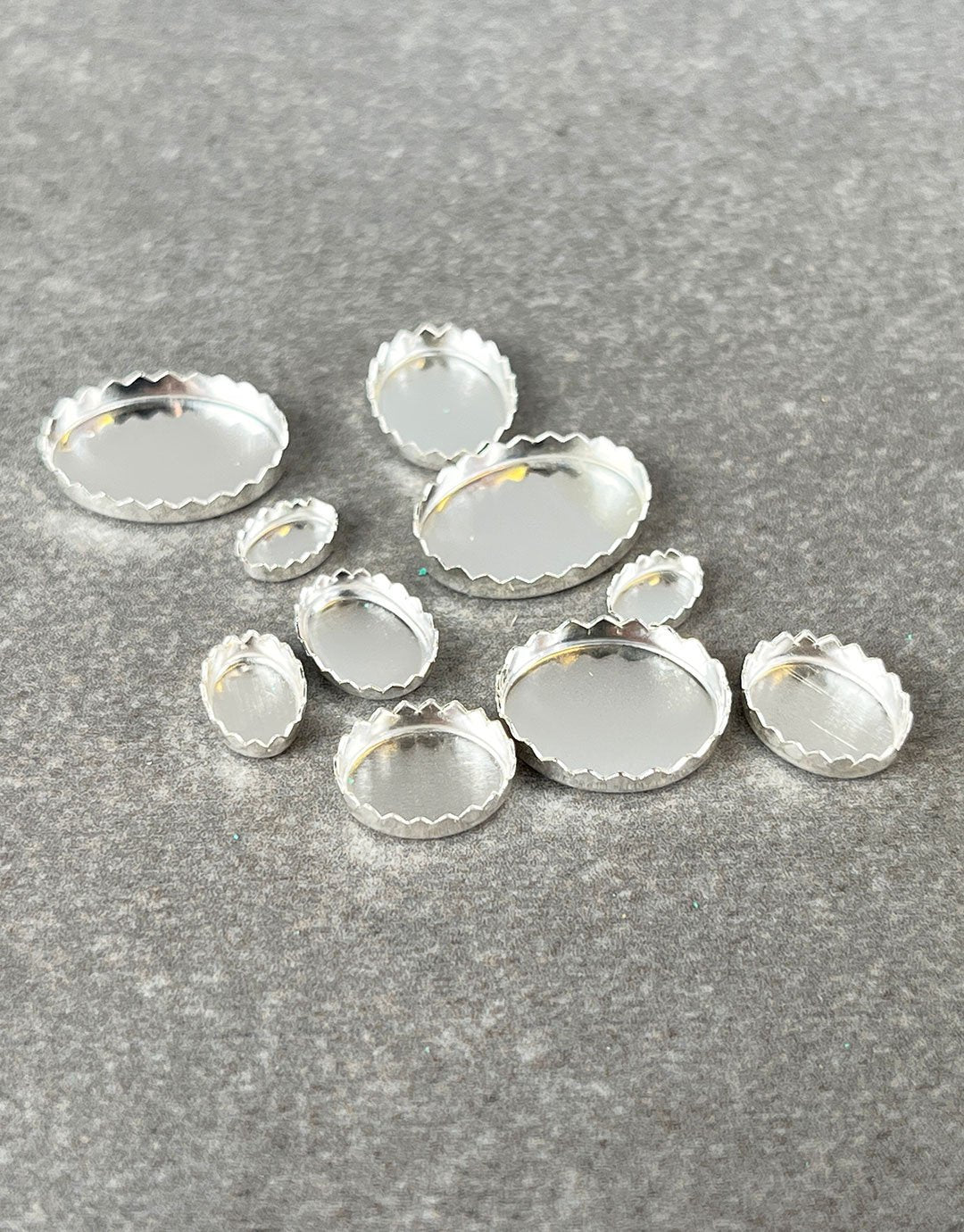 518S = Sterling Silver Oval Serrated Bezel Cup (pkg/5)