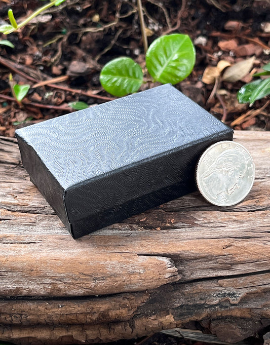 DBX2821B = BOXES - COTTON FILLED BLACK SWIRL 2-5/8'' x 1-1/2'' x 7/8'' CASE 100