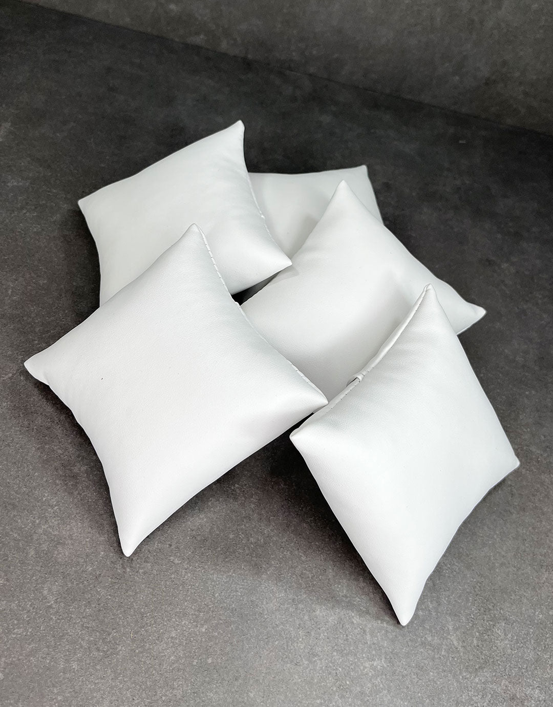 DIS6120 = White Leatherette Pillow for Watches or Bracelets 4''x4'' (Pkg of 5)