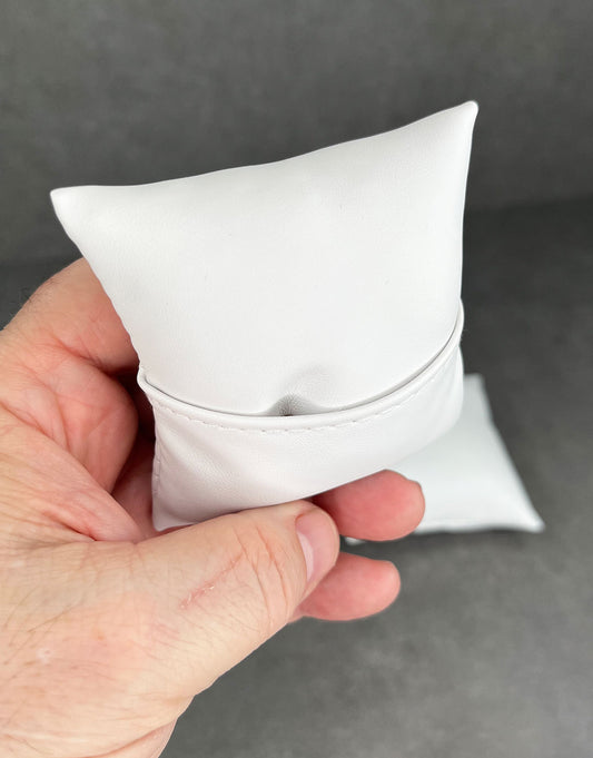 DIS6120 = White Leatherette Pillow for Watches or Bracelets 4''x4'' (Pkg of 5)