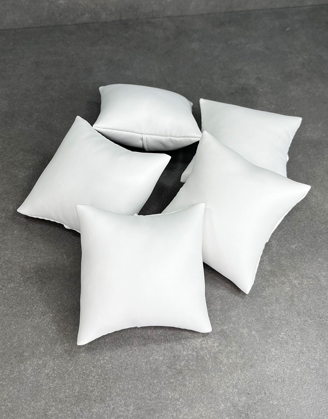 DIS6130 = White Leatherette Pillow for Watches or Bracelets 3''x3'' (Pkg of 5)