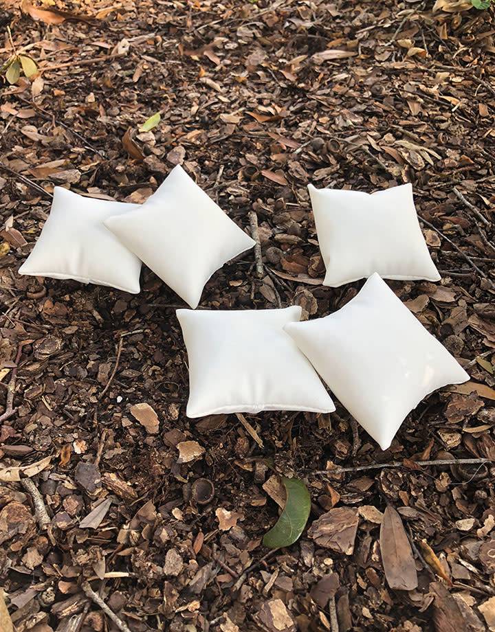 DIS6130 = White Leatherette Pillow for Watches or Bracelets 3''x3'' (Pkg of 5)