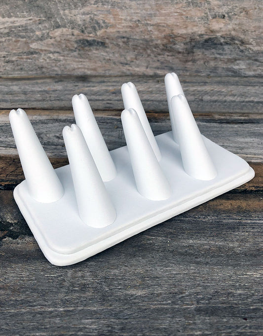 DRG6437 = White Leatherette Seven Finger Ring Display 6-3/4" x 3-7/8"