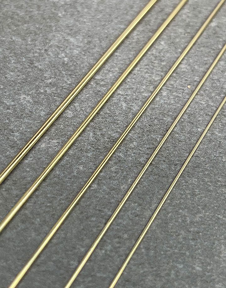 GW = 14K Yellow Gold Round Wire (sold by the inch)