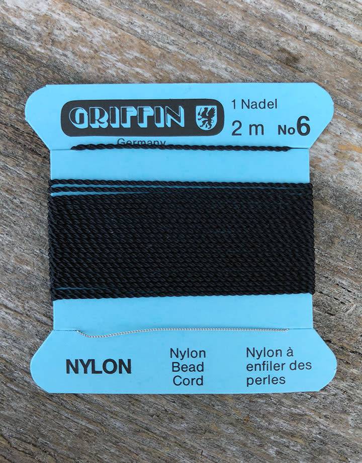 38.0706 = Black Nylon Beading Cord #6 on Card with Needle