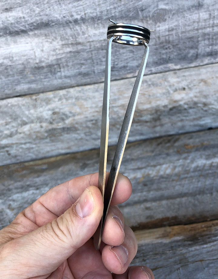 48.230 = TWEEZER RING HOLDING