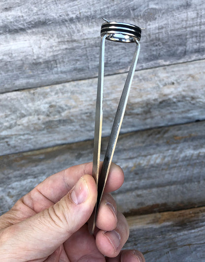 48.230 = TWEEZER RING HOLDING