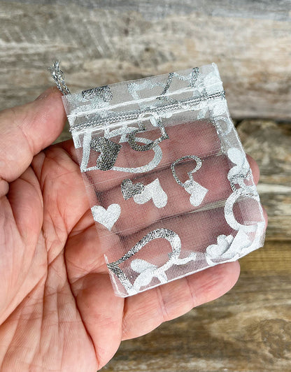 DBX1292HW = Organza Drawstring Pouches White with Silver Hearts 2-3/4''x3'' (Pkg/10)