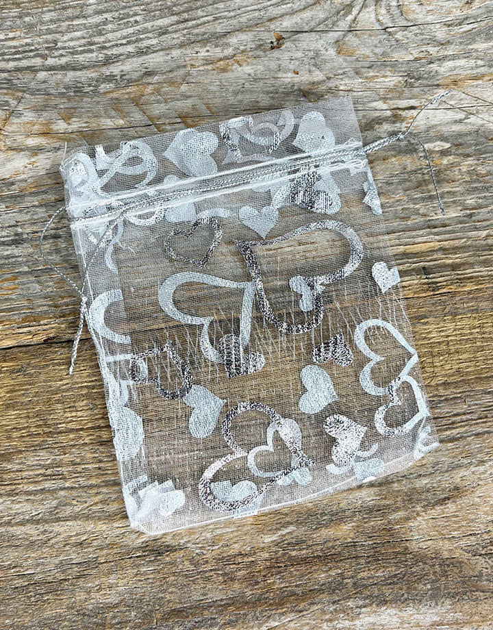 DBX1293HW = Organza Drawstring Pouches White with Silver Hearts 3''x4'' (Pkg/10)