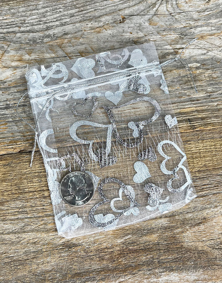 DBX1293HW = Organza Drawstring Pouches White with Silver Hearts 3''x4'' (Pkg/10)