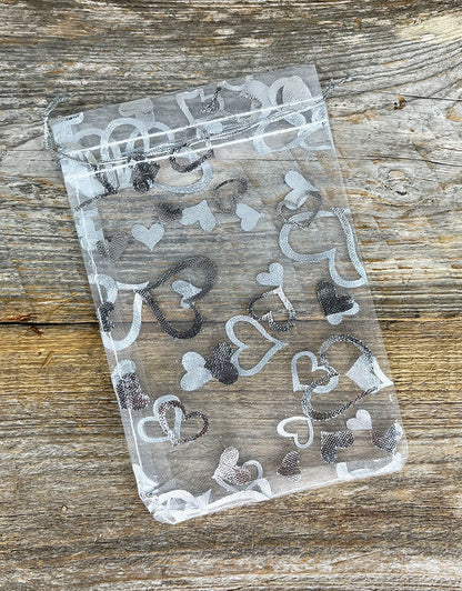 DBX1294HW = Organza Drawstring Pouches White with Silver Hearts 4''x5'' (Pkg/10)