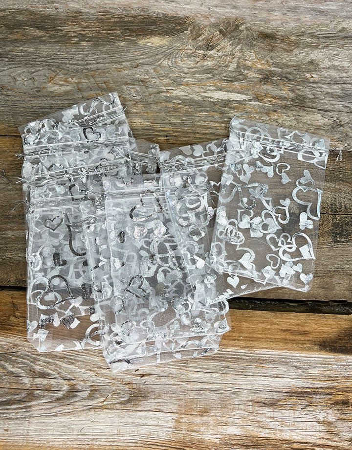 DBX1294HW = Organza Drawstring Pouches White with Silver Hearts 4''x5'' (Pkg/10)