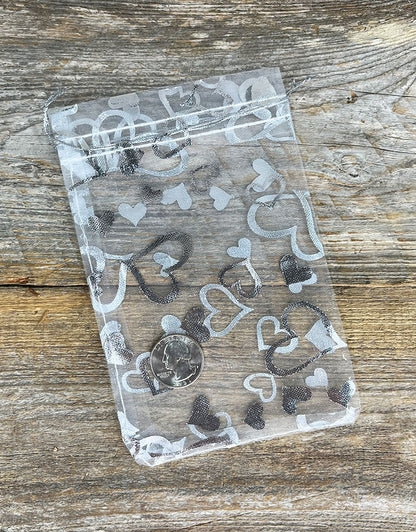 DBX1294HW = Organza Drawstring Pouches White with Silver Hearts 4''x5'' (Pkg/10)