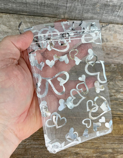 DBX1294HW = Organza Drawstring Pouches White with Silver Hearts 4''x5'' (Pkg/10)