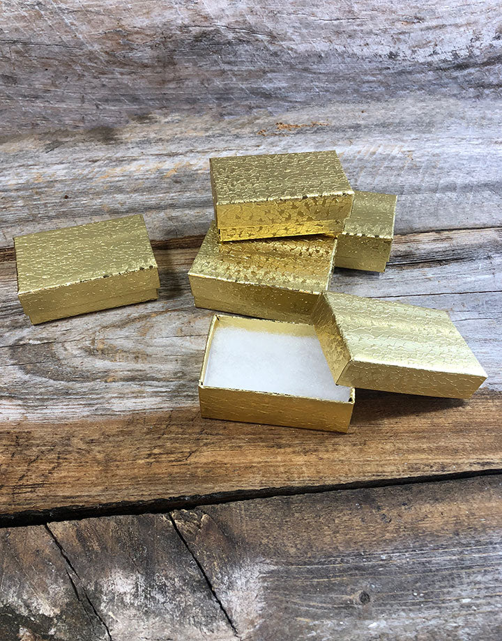 DBX2821G = BOXES - COTTON FILLED GOLD FOIL  2-5/8'' x 1-1/2'' x 7/8''   CASE 100