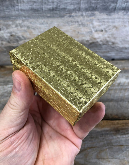 DBX2832G = BOXES - COTTON FILLED GOLD FOIL  3-1/4'' x 2-1/4'' x 1''  CASE 100