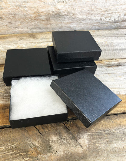 DBX2833B = BOXES - COTTON FILLED BLACK SWIRL  3-1/2'' x 3-1/2'' x 1''  CASE 100