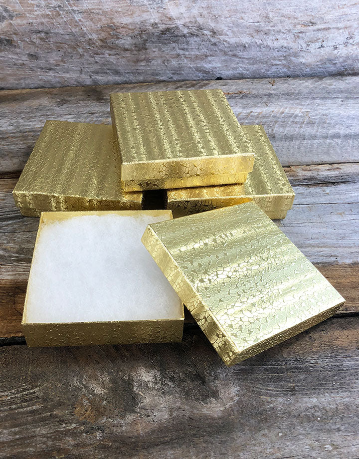 DBX2833G = BOXES - COTTON FILLED GOLD FOIL  3-1/2'' x 3-1/2'' x 1''  CASE 100