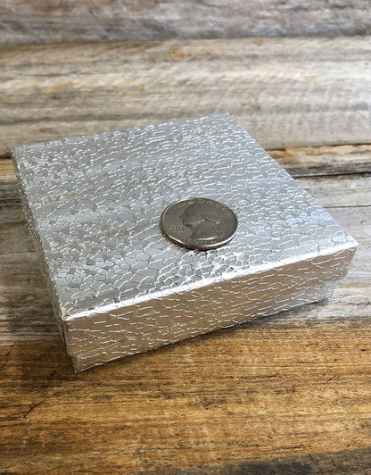 DBX2833S = BOXES - COTTON FILLED SILVER FOIL  3-1/2'' x 3-1/2'' x 1''  CASE 100