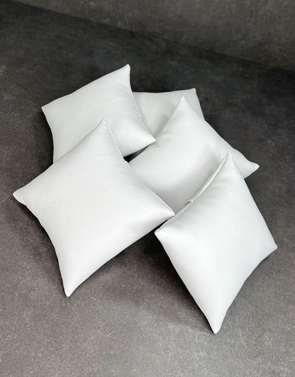DIS6120 = White Leatherette Pillow for Watches or Bracelets 4''x4'' (Pkg of 5)
