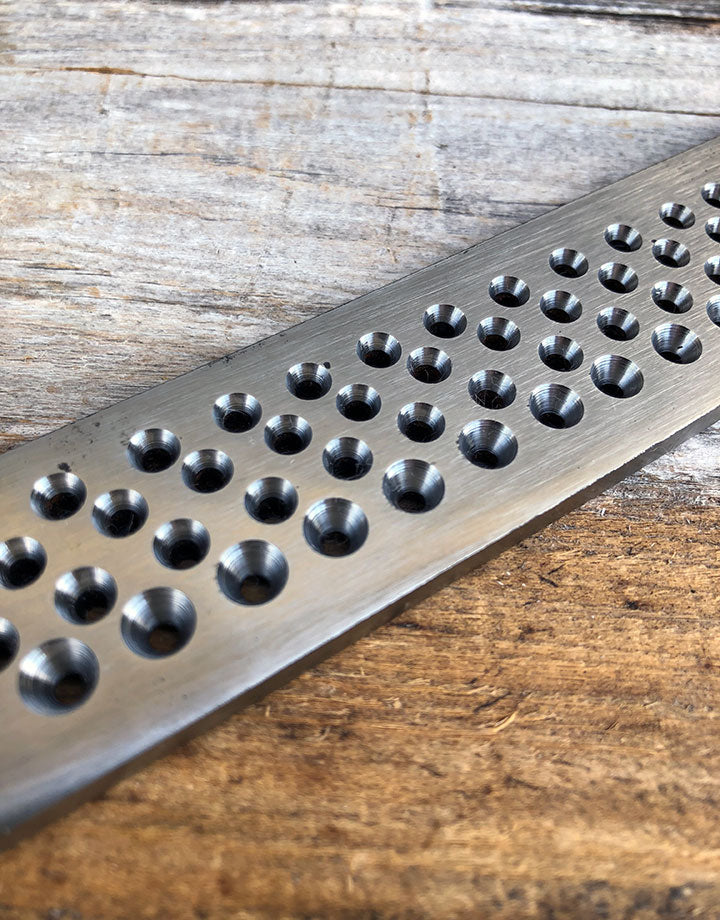 DP7112 = Economy Drawplate Round Holes (82 holes)  0.12 to 2.5mm