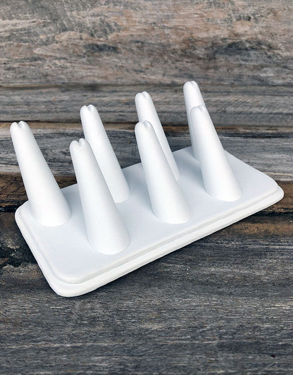 DRG6437 = White Leatherette Seven Finger Ring Display 6-3/4" x 3-7/8"