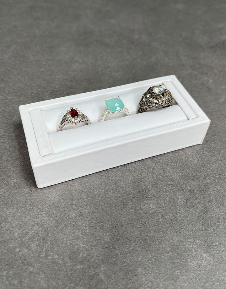 DRG6901 = White Leatherette Ring Slot Display 4-1/8"
