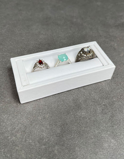 DRG6901 = White Leatherette Ring Slot Display 4-1/8"