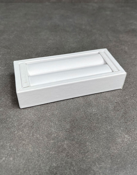 DRG6901 = White Leatherette Ring Slot Display 4-1/8"
