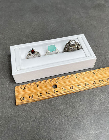 DRG6901 = White Leatherette Ring Slot Display 4-1/8"
