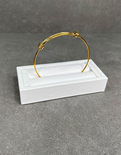 DRG6901 = White Leatherette Ring Slot Display 4-1/8"