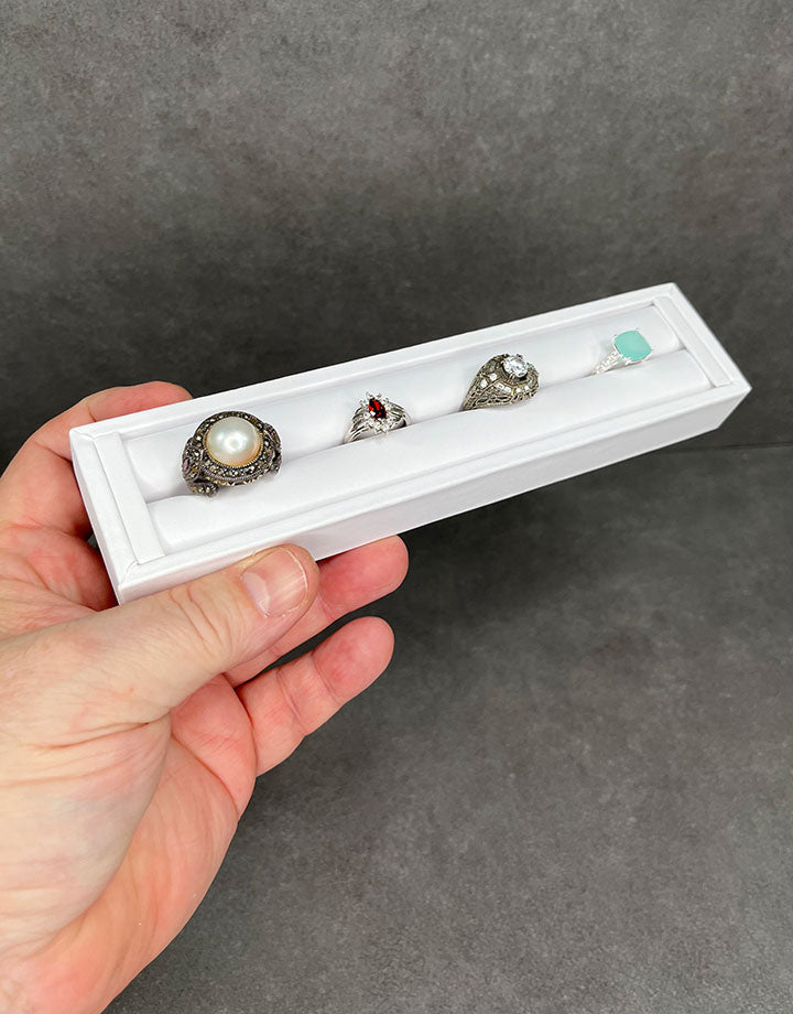 DRG6903 = White Leatherette Ring Slot Display 7-3/4"