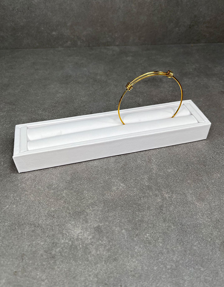 DRG6903 = White Leatherette Ring Slot Display 7-3/4"