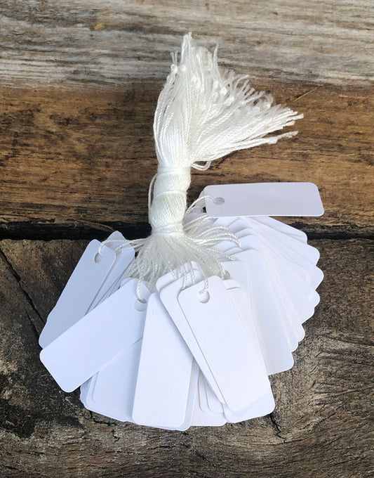 DTA1769 = White Paper String Tags (7/16''x1-1/8'') (Pkg of 1000)