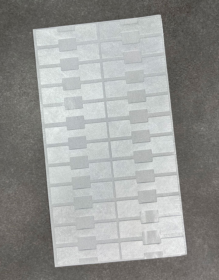 DTA7022 = Silver Tyvek Square Dumbbell Tags 1-9/16'' x 7/16'' (Pkg of 1000)