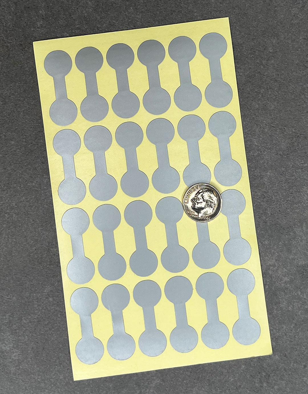 DTA7092 = Silver Dumbbell Tags 1-3/8'' x 1/2'' (Pkg of 1000)