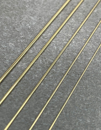 GW = 14K Yellow Gold Round Wire (sold by the inch)